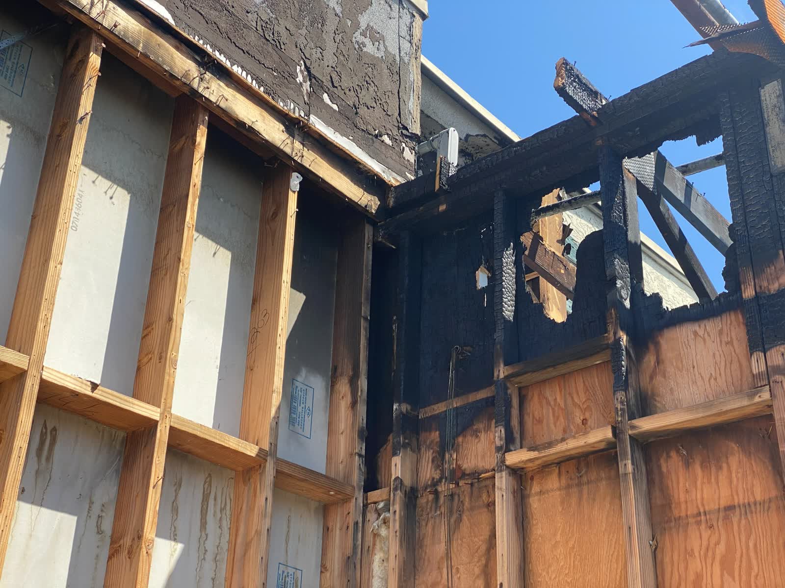 Fire repair archive image showing damaged wall conditions